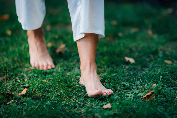 Did you know there's health benefits to walking barefoot in the grass?