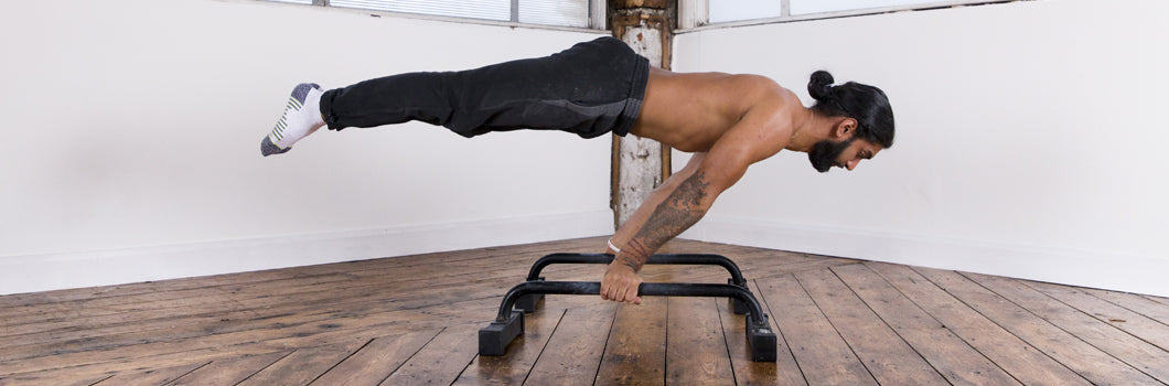 Learn To Planche On Parallettes