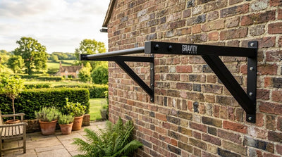 Gravity Fitness heavy duty wall mounted pull up bar installed outdoors on a brick wall