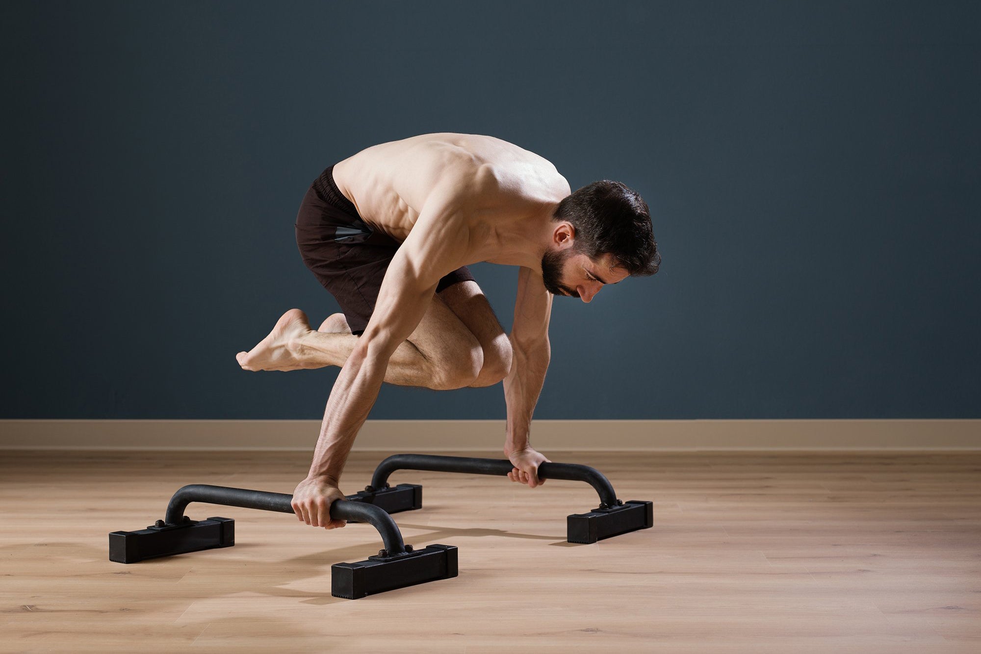 Parallettes: Wood or Steel? - Gravity Fitness Equipment